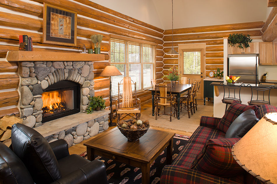 log residence living room with crackling fire