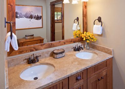 summer cabin residence bathroom with double sinks
