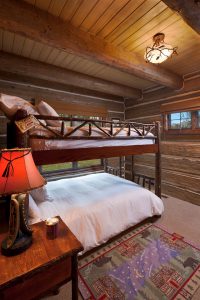 summer cabin with twin bunkbeds in bedroom