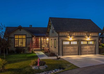 rmr group construction exterior with landscaping and inviting lights on