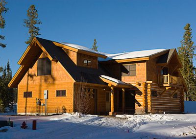 log cabin construction in Big Sky, Montana in winter