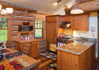 cowboy heaven kitchen with wooden cabinets and floors