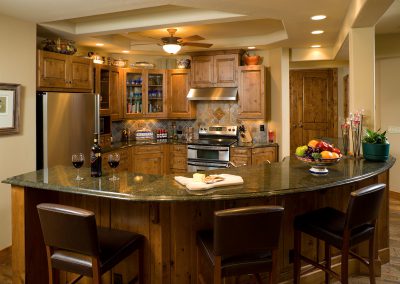 cummings interior kitchen with recessed lighting and island seating