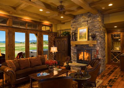 black bull clubhouse living room with fireplace and picture windows
