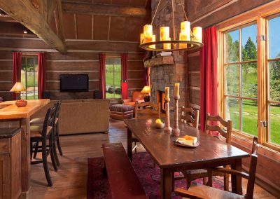 dining room area of a house modeled in the style of an old forest service cabin