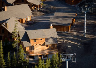 powder ridge aerial view chairlift and log cabins